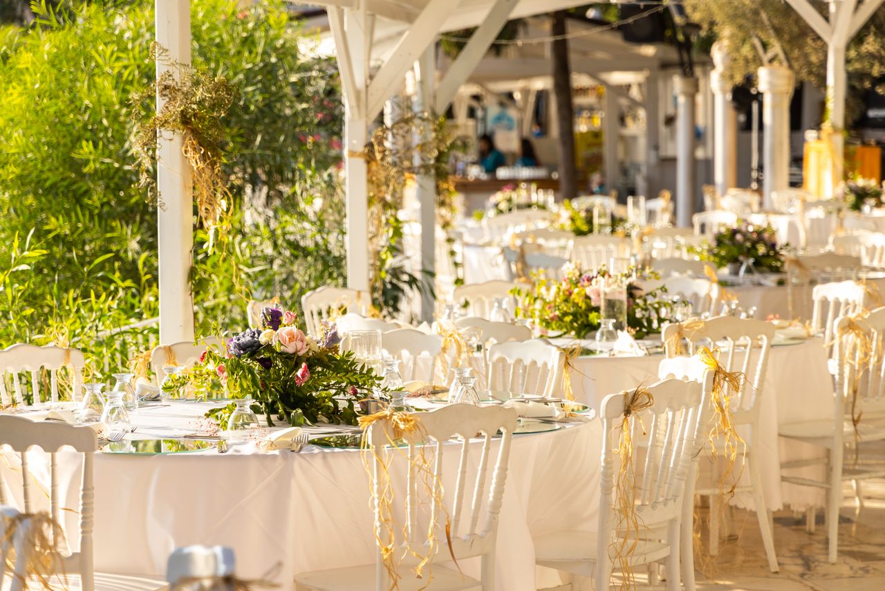 Crafting Captivating Headlines: Your awesome post title goes here Beautifully arranged outdoor wedding reception with floral centerpieces and white decor.